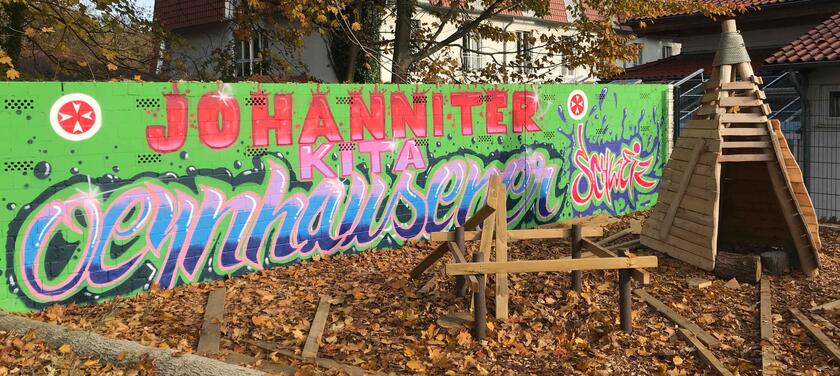 Graffiti-Wand Kita Oeynhausener Schweiz  im Außenbereich