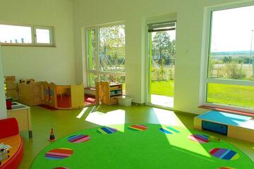 grüner Gruppenraum Johanniter-Kinderkrippe "Pusteblume"